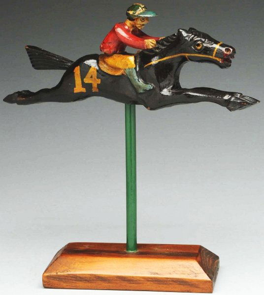 Wonderful Hand-Carved Jockey Riding Race Horse.: 1930s. Possibly an amusement park game. Both pieces are hand-carved and retain their original surface. Condition (Excellent). Size 10" T.