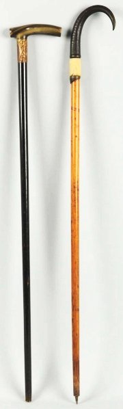 Lot of 2: Wooden Canes.: Includes one with animal horn and hoof handle, and second has a wooden and gold top. Condition (Excellent). Size Largest: 34 - 1/2" L.