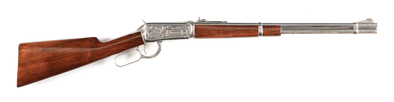 (C) PRE WAR ENGRAVED WINCHESTER MODEL 94 LEVER ACTION CARBINE.: Manufactured in 1937. This pre war carbine was expertly engraved. The frame features near full coverage deep chisel relief Arabesque scroll with punch dot back ground, decorative borders and flora whi