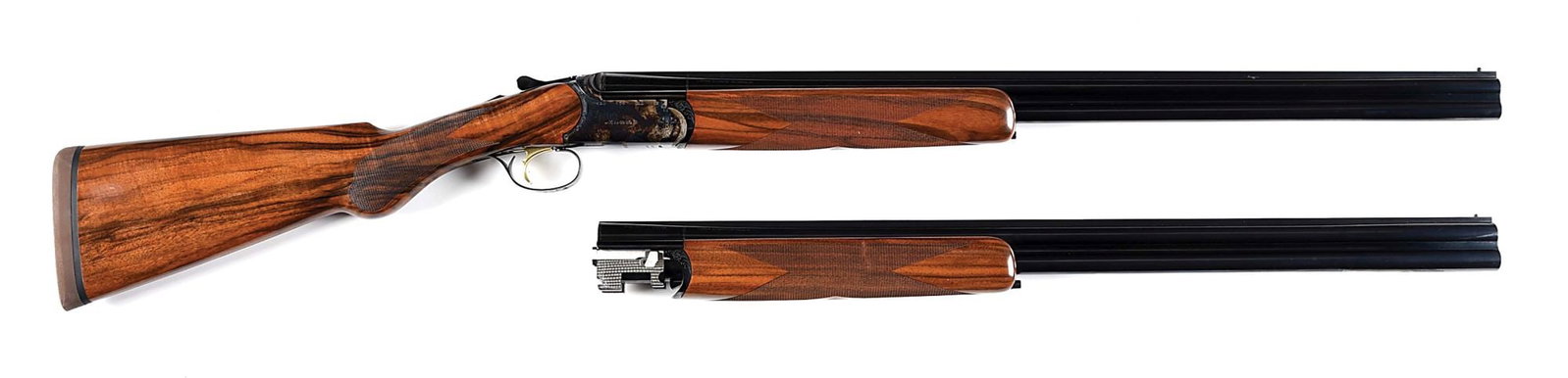 (M) CAESAR GUERINI ELLIPSE LIMITED OVER UNDER SHOTGUN 2 BARREL SET IN 20 AND 28 BORE.: Manufactured in 2010. Features include 20 gauge over under blued barrel set with 3" chambers and checkered walnut forearm, 28 gauge over under blue barrel set with 2 - 3/4" chambers and checkered waln
