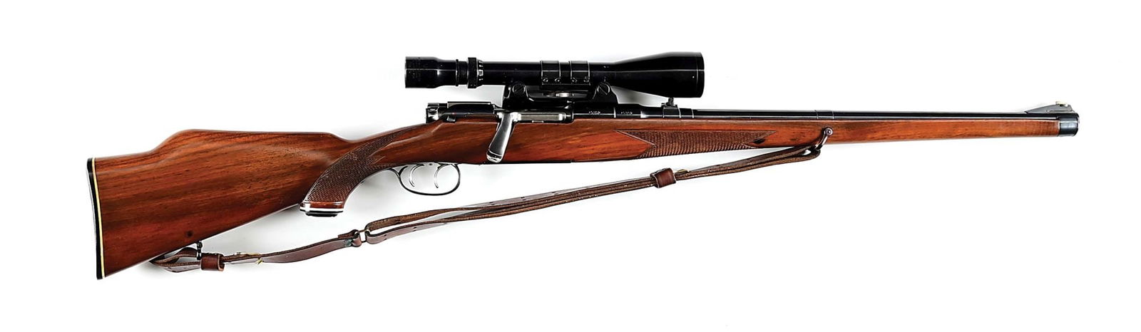 (C) STEYR MANLICHER SCHOENAUER MC BOLT ACTION RIFLE IN .270 WINCHESTER.: Manufactured 1962. Full length Mannlicher checkered walnut stock with high Monte Carlo comb, black grip cap and butt plate with white spacers, and sling. Barrel sports a ramp front sight, a folding le