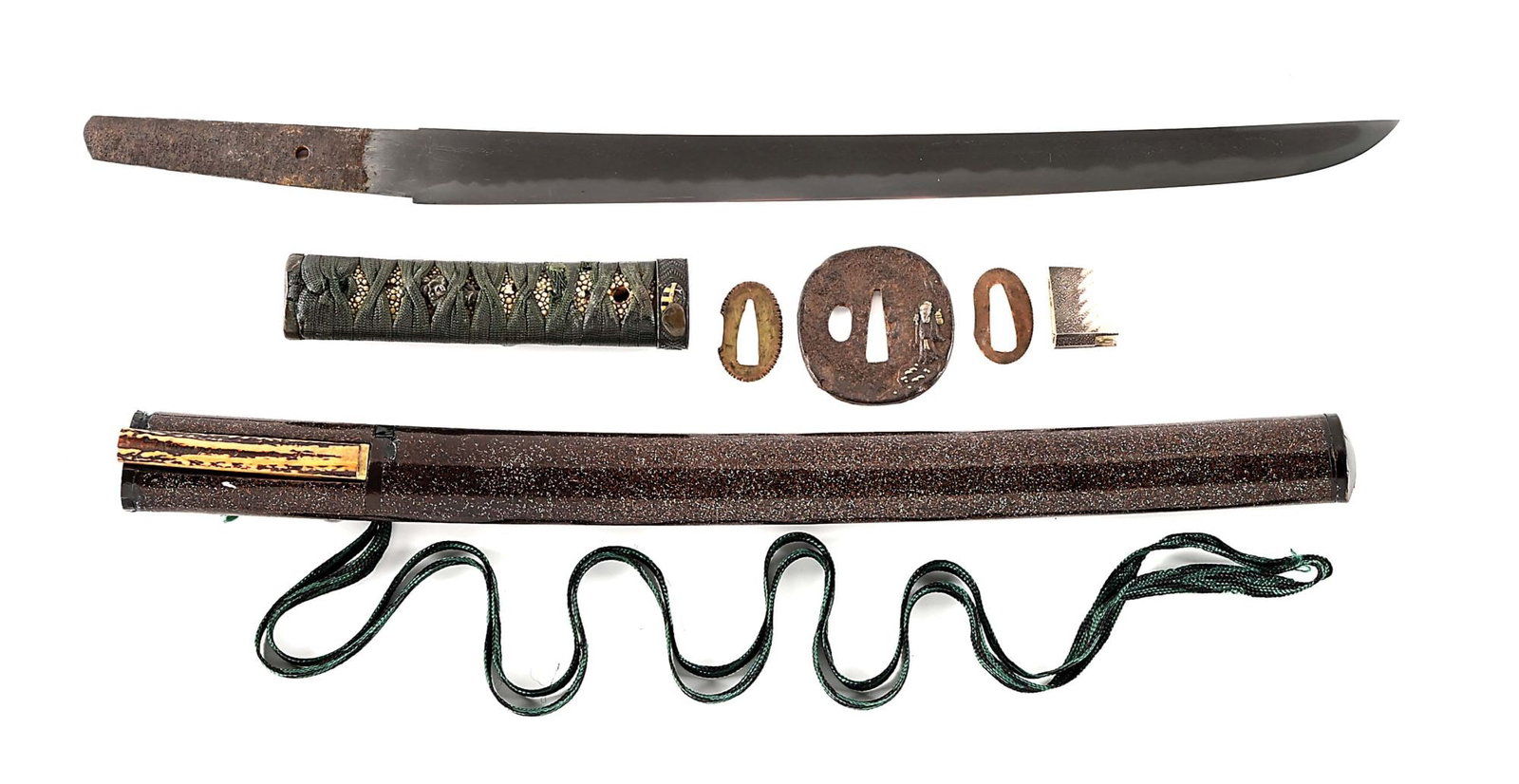 A GOOD WAKIZASHI IN KOSHIRAE.: 38.3cm (approximately 15 - 1/16") nagasa of hira zukuri form. Mokume hada (grain) with a nice gunome hamon with thin ashi and yo. Boshi is ko maru with a long turnback. Ubu, mumei, with kesho yasurime