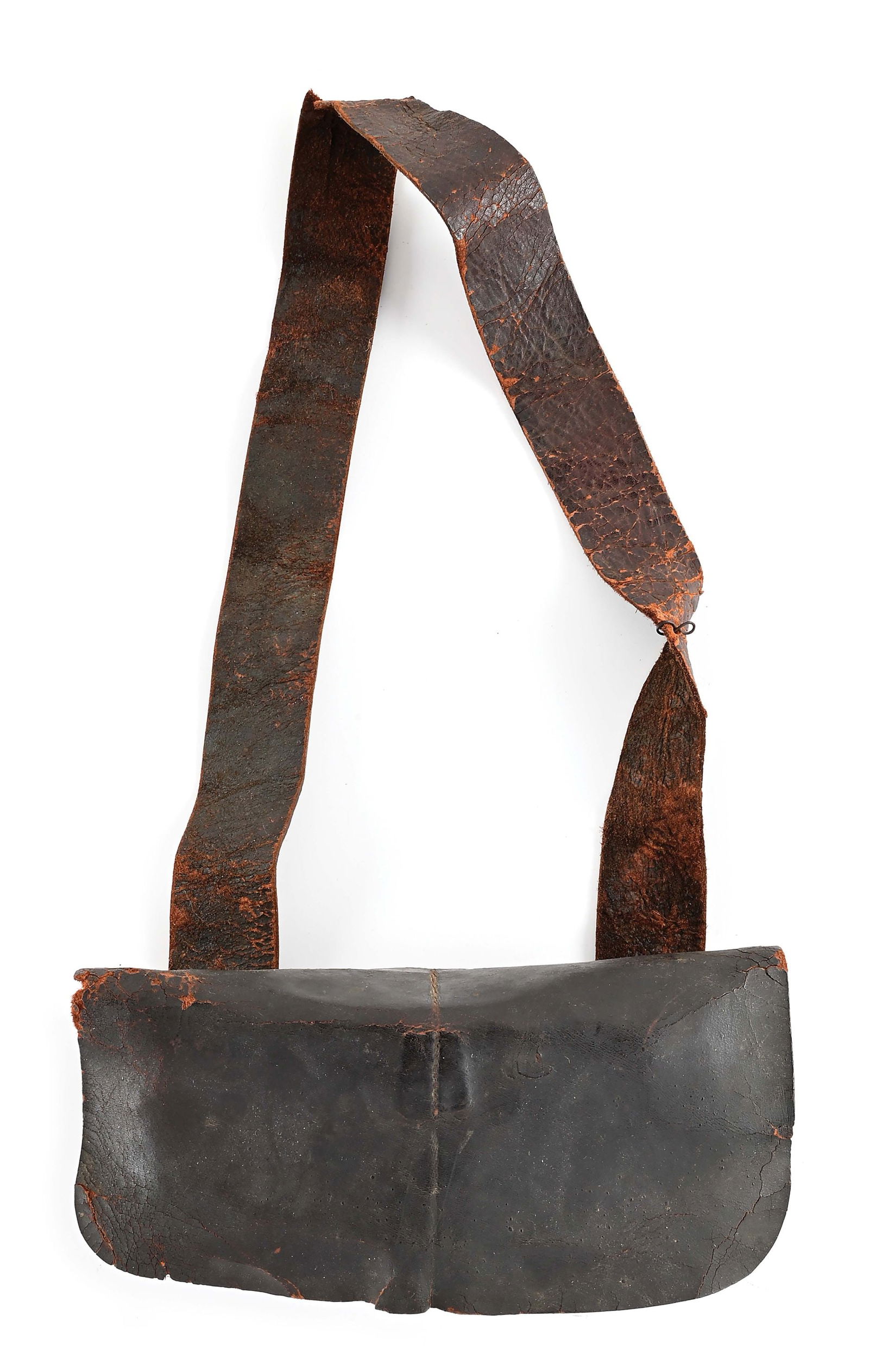 REVOLUTIONARY WAR ERA AMERICAN 24-HOLE CARTRIDGE BOX WITH STRAP.: Constructed from three pieces of brown leather, excluding the strap. The leather covered curved wood black has 24 holes of .75 caliber. The original leather button to fasten the lid is detached, but c