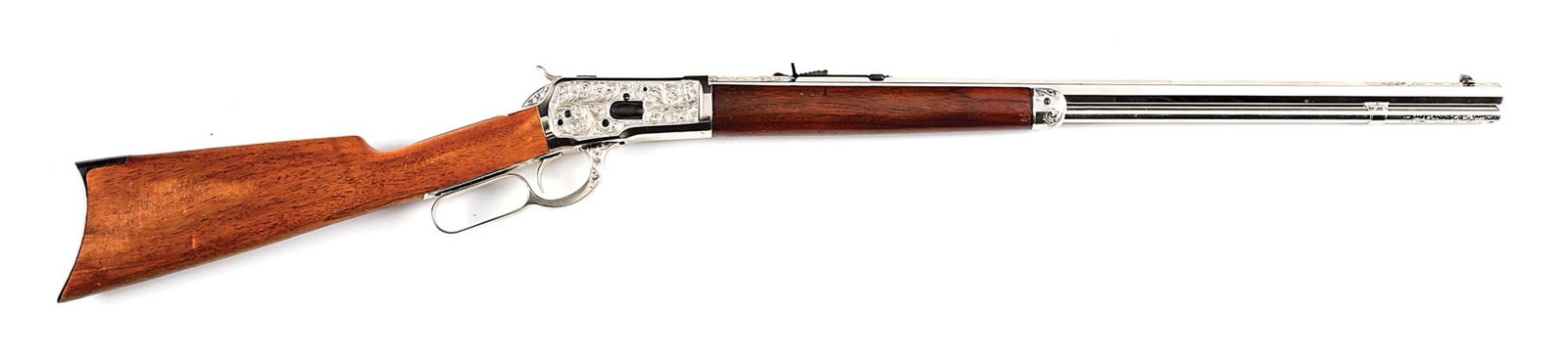 (CO ENGRAVED FULL PLATE WINCHESTER MODEL 1892 LEVER ACTION RIFLE.: Manufactured in 1915. This beautiful custom full nickel rifle features a striking large pattern leaf scroll with punch dot background covering both sides of the receiver with nitre blue screws. The bo