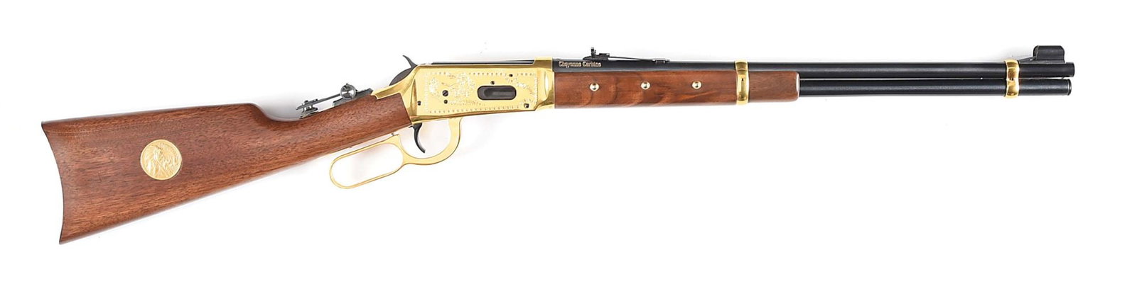 (M) CHEYENNE COMEMMORATIVE WINCHESTER MODEL 94 SADDLE RING CARBINE IN .44-40 WCF.: 1 of 11,225 manufactured in 1977. Round steel barrel with blue finish, right side is marked in gold lettering "Cheyenne Carbine", with hooded silver bead front sight and standard elevator rear sight. 