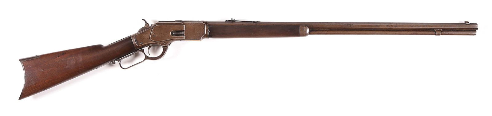 (A) EXTRA LENGTH WINCHESTER MODEL 1873 LEVER ACTION RIFLE.: This 4" extra length rifle was manufactured in 1885. All other features are standard: full octagon barrel, full length magazine tube, German silver tip front sight, replaced flat top rear sight, blue
