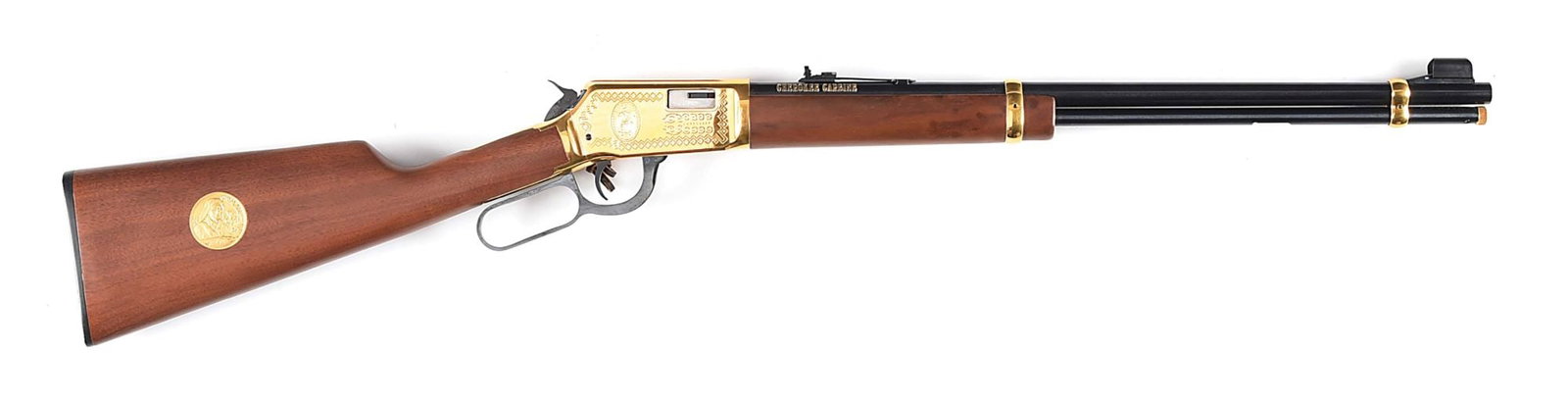 (M) CHEROKEE COMEMMORATIVE WINCHESTER MODEL 9422 XTR SADDLE RING CARBINE.: Blued barrel with fixed hooded front sight and adjustable rear elevation sight. Receiver and barrel bands are gold plated. Gun is factory roll marked on both sides with a decorative border of Indian d