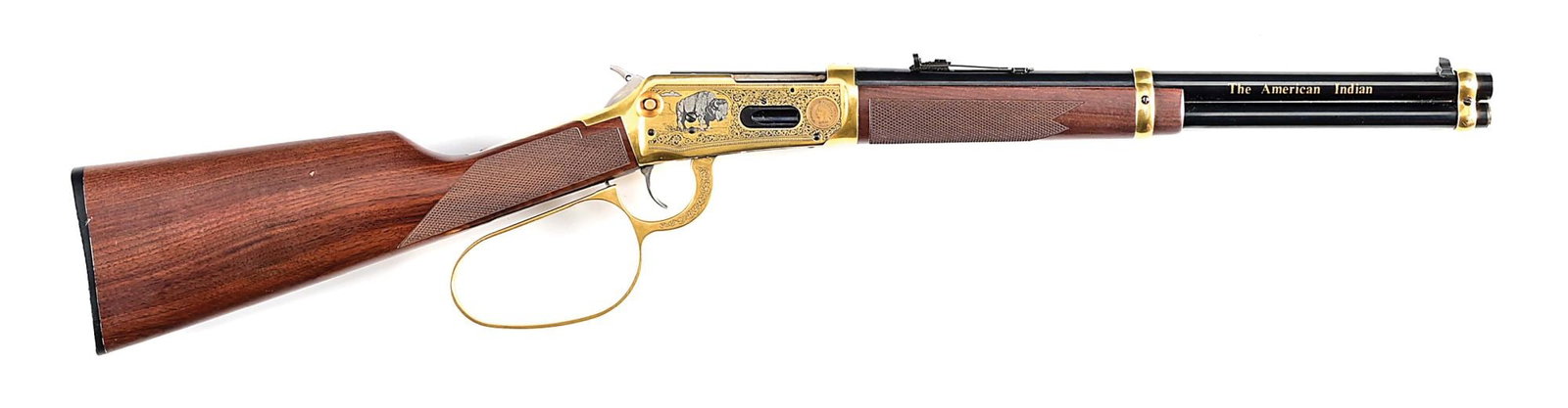 (M) THE AMERICAN INDIAN TRIBUTE WINCHESTER MODEL 94AE LEVER ACTION CARBINE IN .45 COLT.: Limited edition of 300 made. Blued carbine length barrel marked in gold at the end on the right side "The American Indian" and "150 of 300" on the left. Full length magazine tube retained by a pair of
