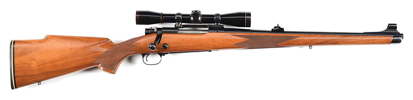 (C) RARE MANNLICHER STOCKED WINCHESTER MODEL 70 BOLT ACTION RIFLE IN .243 WIN.: Available from 1969 to 1972, only 2401 Mannlicher stocked Model 70s were made, just 396 in .243 chambering. This example was manufactured in 1970. Classic blued Winchester Proof Steel barrel with tall
