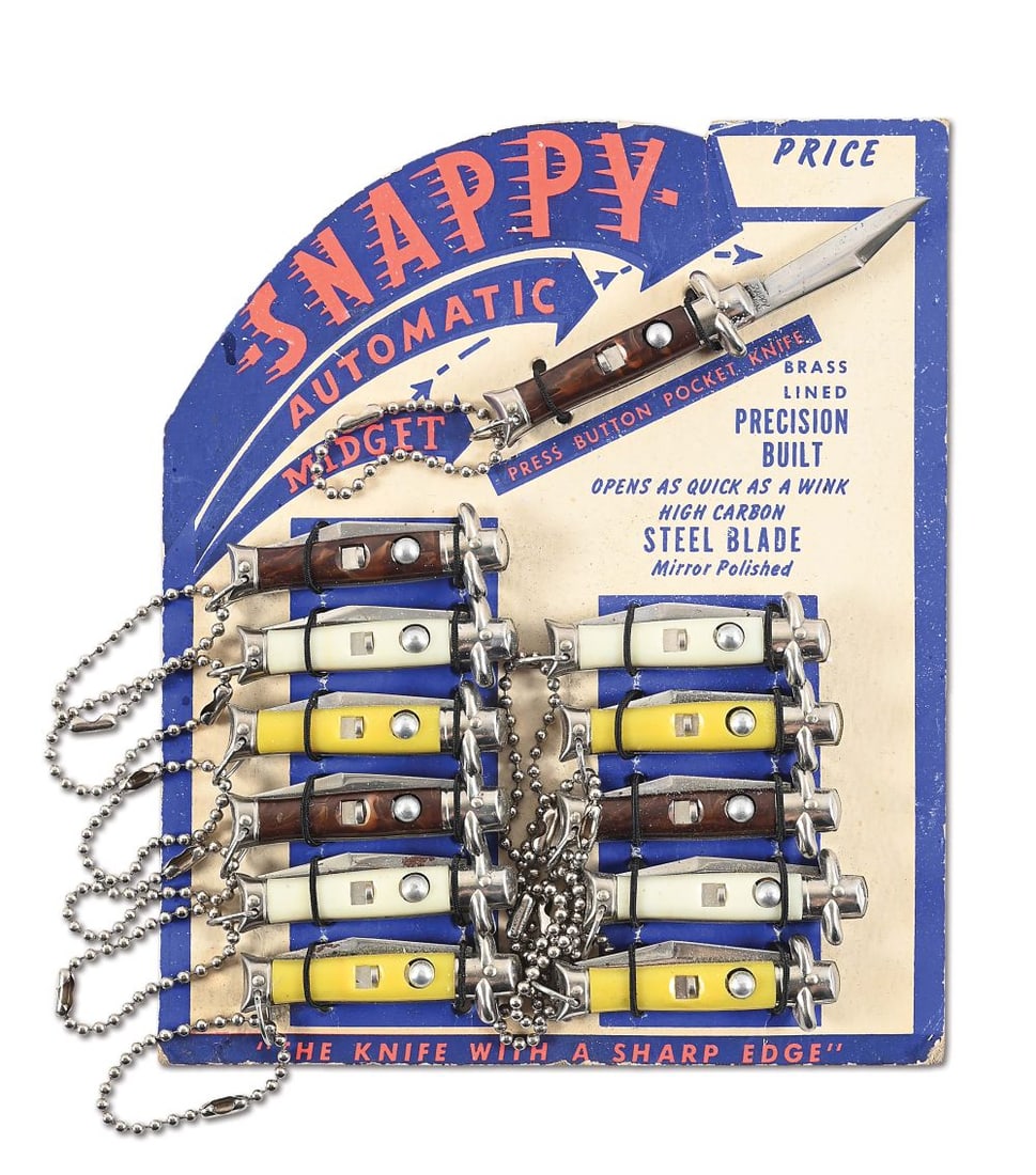 SNAPPY-AUTOMATIC MIDGET STORE DISPLAY CARD WITH 12 AUTOMATIC KNIVES.: Lot consists of an original store display from the 1950s. It is a cardboard, easel back that contains 12 original knives that have been on this display since uncovered around 1960. Each knife measures