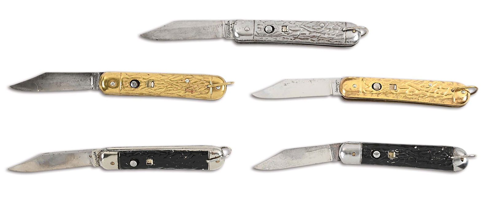 LOT OF 5: EDGEMASTER AUTOMATIC KNIVES IN DISPLAY CASE.: This was Edgemaster's line of post WWII military style switchblades. All five were made without bolsters and all have a lanyard ring. There are two brass models, one tin model, and two black wormwood