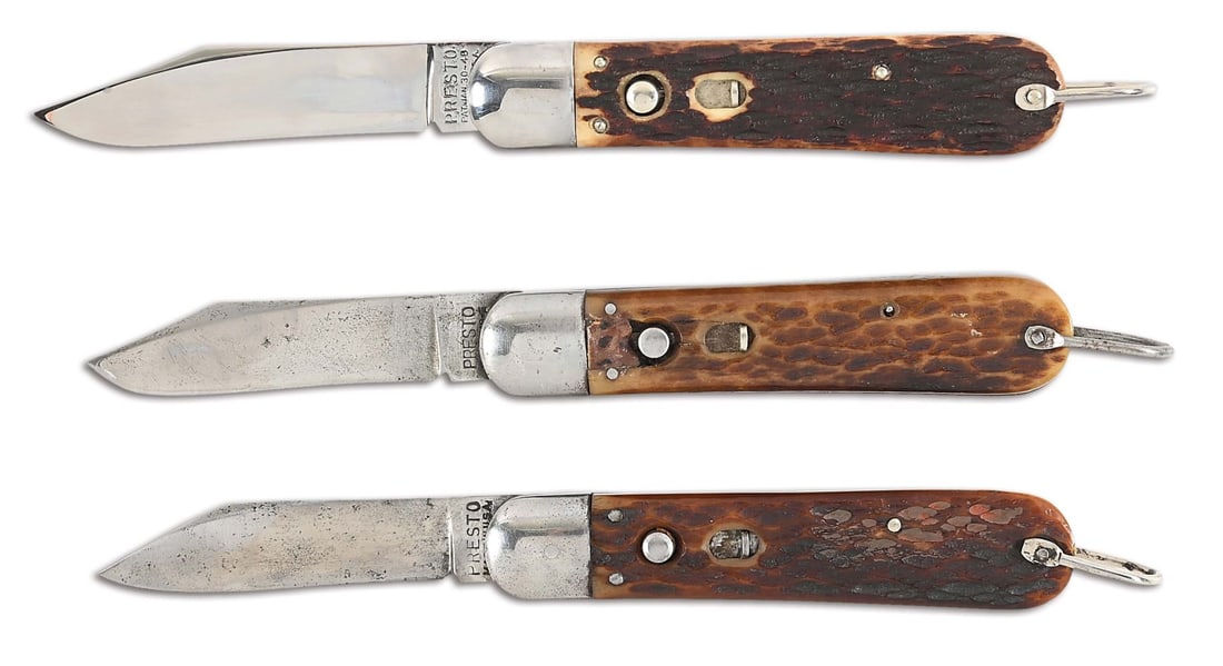 LOT OF 3: PRESTO AUTOMATIC KNIVES.: (A) Marked "PRESTO / PAT. JAN 30-40 / MADE IN U.S.A.". Steel bolsters with stag grip scales. Functioning spring. Bright blade. (B) Marked "PRESTO / PAT PEND-G". Steel bolsters with jigged bone grip sc