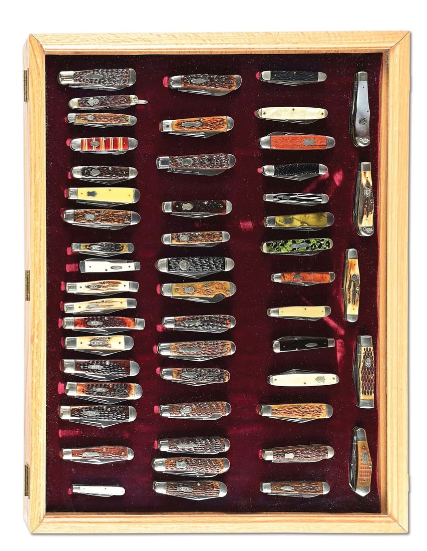 CASED COLLECTION OF 51 AMERICAN FOLDING KNIVES.: Both antique and vintage. Circa 1920s-Case Lighting S era. The largest folding knife in the group is a Robeson Shuredge with Rochester, New York, address that measures 3 - 3/4". Highlight of the group