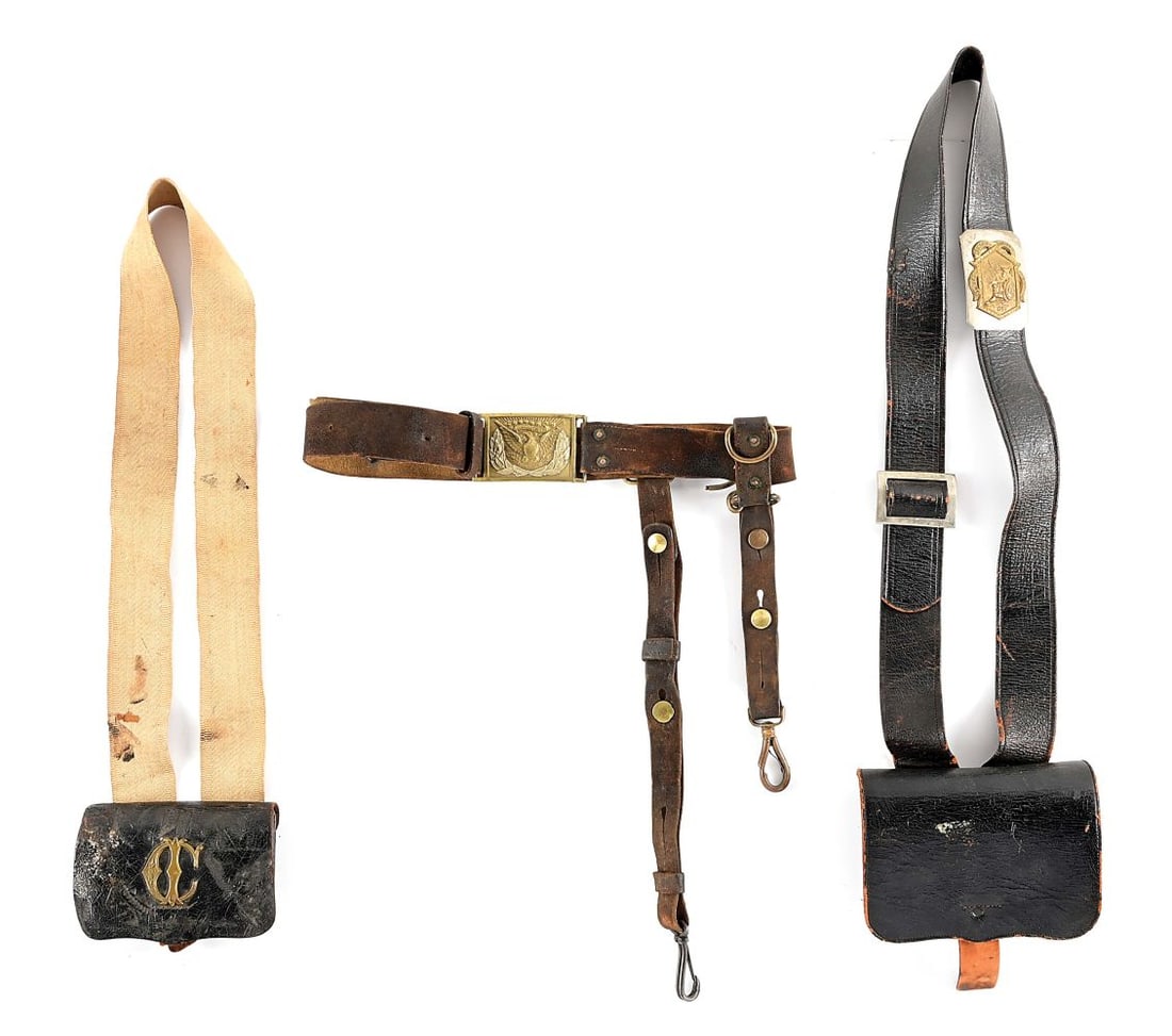 LOT OF 3: US CIVIL WAR AND INDIAN WARS BELTS AND CARTRIDGE BOXES.: Lot consists of: (A) Tarred leather militia cartridge box with white linen strap and die struck brass insignia affixed to pouch. (B) Complete U.S. Civil War period cavalry saber belt in buff leather.
