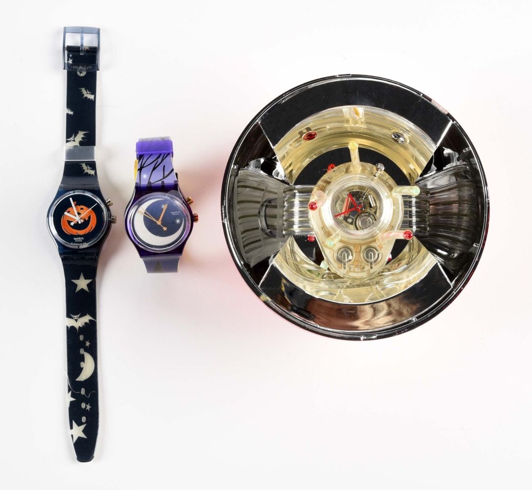 LOT OF 3: SPECIALS AND WORLDWIDE SWATCHES: (A) GN906 "Happy Nightmare" Specials Collection Swatch Watch. Issued in Halloween 1998. (B) GP900PACK "Witch Party" Worldwide Packaging Swatch Watch. Designed by Andrea Arrigoni. Issued in Halloween 2