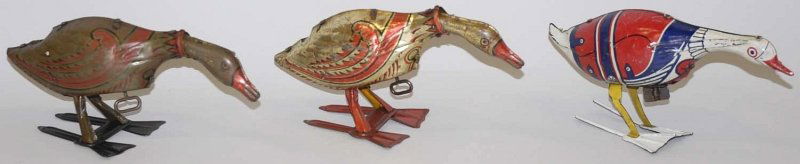 Lot of 3: Tin Litho Marx Wind-Up Goose Toys.: Two are Golden Goose. One is Gertie Goose. None have eggs. Some wear to litho and scratching throughout. Condition (Good - Very Good). Size Largest: 5 - 1/2" T. Largest: 5 - 1/2" T.