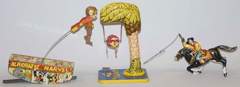 Lot of 3: American Tin Litho Wind-Up Toys.: Includes a Marx Cowboy Rider, a Marx Acrobat Marvel and a unique art Bombo Monkey. Monkey is missing rubber ears. Some minor scratching and wear. Condition (Very Good). Size Largest: 9 - 3/4" T. Large