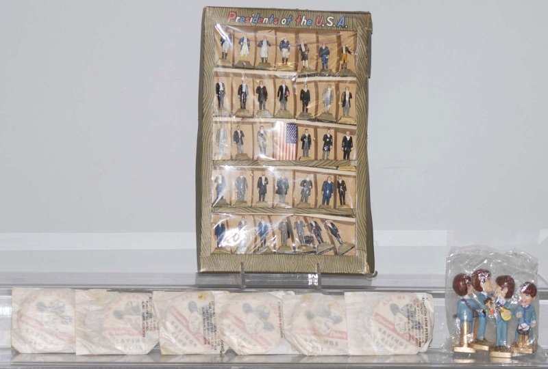 Lot of 8: Vintage Character Items.: Includes a generic Beatles cake set sealed in bag, Marx Presidents of the United States plastic figures in original box, and six Hopalong Cassidy savings club buttons still in packaging. Condition (Ex