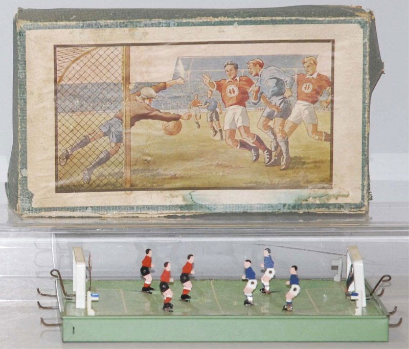 European Tin Litho Soccer Game in Box.: Includes original box. Box and toy are unmarked. Looks Eastern European, probably Hungarian or Czechoslovakian. Players are controlled by levers. Box has nice lid with depictions of player kicking bal