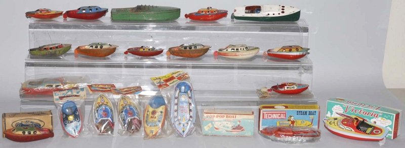 Lot of Approximately 20: Toy Boats.: Various makers include Japanese companies. Some with nice tin lithography and includes a lot of pop-up boats. Includes some in original boxes and some in original packaging. Condition (Very Good). Siz