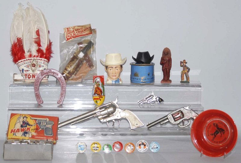 Large Lot of Miscellaneous Western Items.: Includes a Hubley cowboy pistol, a small box of Hawk pistols, several Hopalong Cassidy pins, Davy Crockett and Roy Rogers items and others. Condition (Very Good). Size Largest: 12" T. Largest: 12" T.
