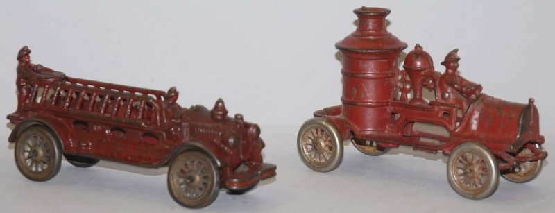 Lot of 2: Cast Iron Fire Pumper Toys.: American. Both with spoked metal wheels and molded drivers. Includes one pumper truck and one ladder truck with some paint loss and crazing. Condition (Very Good). Size Largest: 7 - 1/2" L. Largest: 7