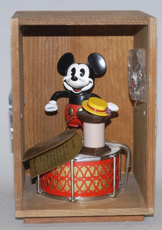 Mickey Mouse Coin Mechanical Bank.: Working. Includes original box. Condition (Near Mint). Size Box: 7 - 1/2" x 7". Box: 7 - 1/2" x 7".
