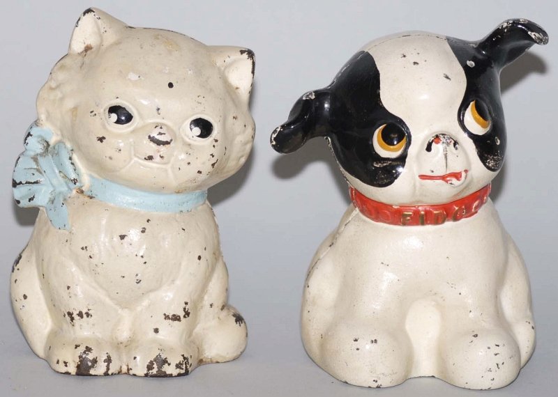 Lot of 2: Cast Iron Still Banks.: Made by Hubley. Includes Fido and Kitty Cat. Condition (Very Good - Excellent). Size Each: 5" T. Each: 5" T.