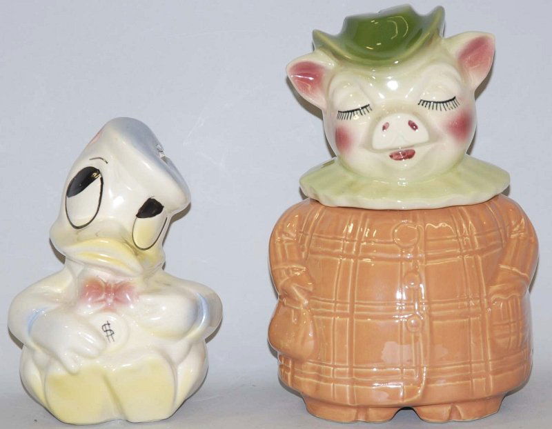 Lot of 2: Pottery Banks.: Includes a Donald Duck and one pig bank/cookie jar. Condition (Near Mint). Size Largest: 10 - 3/4" T. Largest: 10 - 3/4" T.