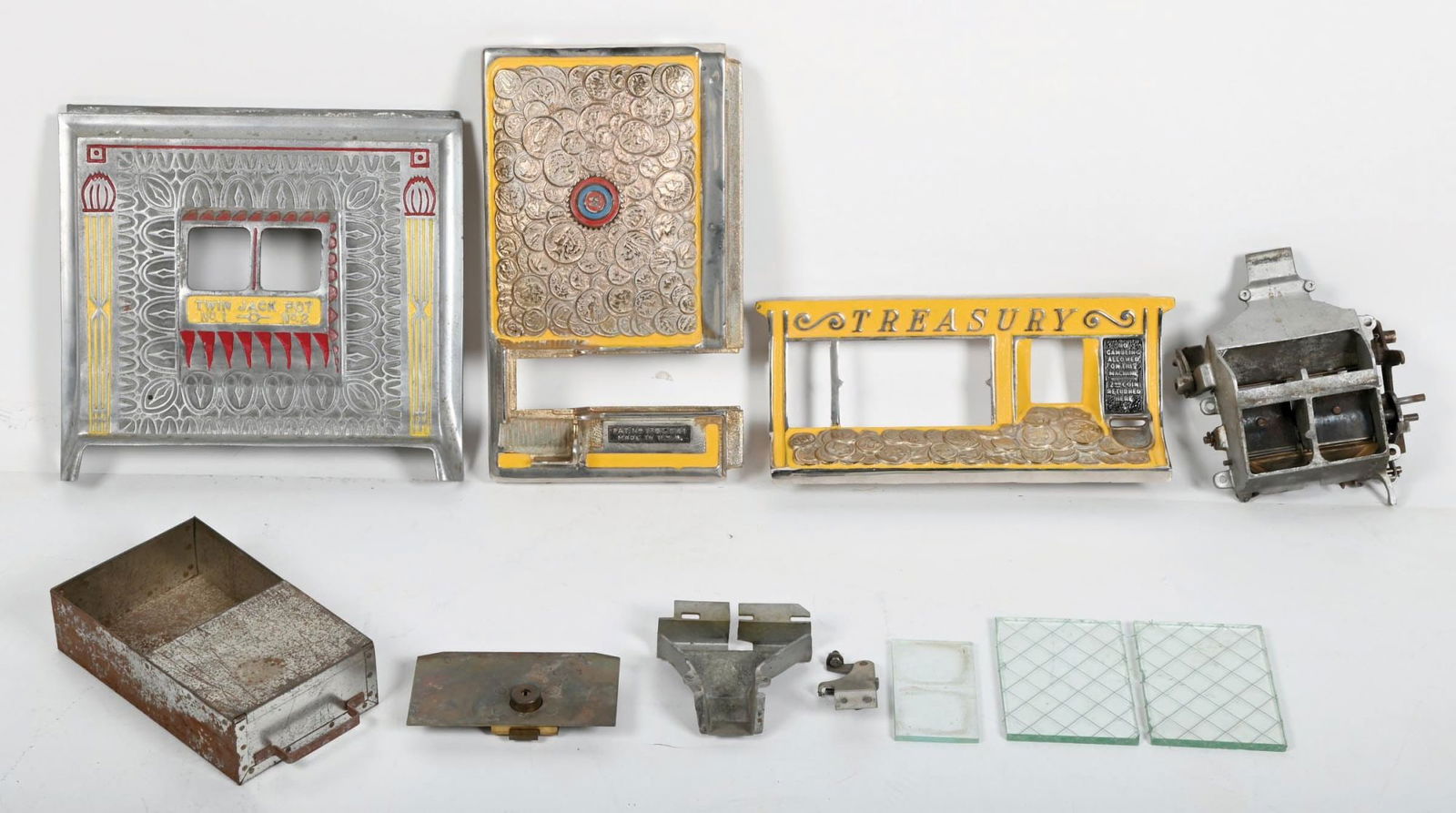 SELECTION OF SLOT MACHINE PARTS: Primarily for Watling slot machines, including some locks, cash door and some castings. Condition: (Good) Dimensions: Largest: 13 - 1/2" x 12 - 1/2".