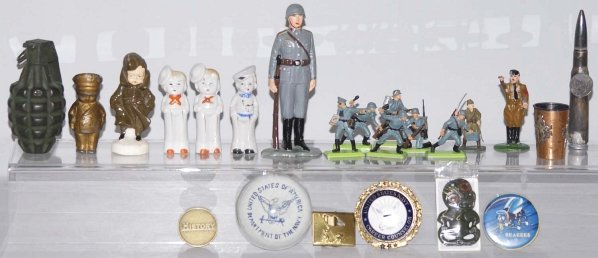 Lot of Small Military Items.: Includes nine Britain soldiers, three bisque soldiers, a grenade and bullet, a Naval paperweight, buttons and others. Condition (Excellent). Size Largest: 6" T.