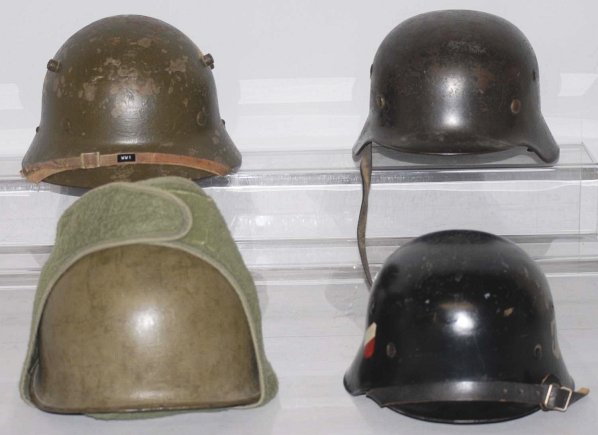 Lot of 4: Metal Helmets.: Includes two German, one U.S., and one Austrian. Condition (Excellent). CORRECTION: Upon further inspection, it is believed that the fourth helmet is Austrian, not U.S.
