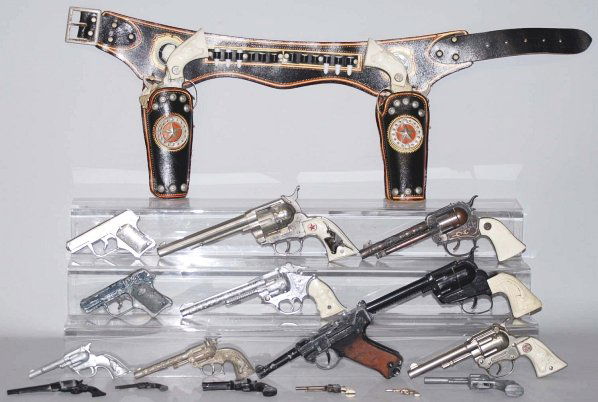 Large Lot of Cap Guns.: Includes one Hubley set with holster and ten others. Condition (Very Good - Excellent). Size Largest: 11" L.