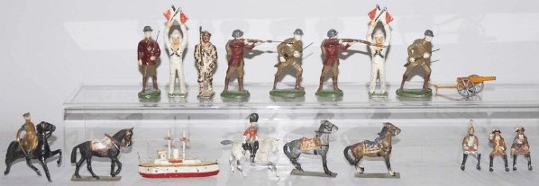 Lot of 15: Composition & Metal Military Items.: Includes small boats, cannons, composition WWI type soldiers marked "Made in Germany", a few metal Britains soldiers (one with broken sword), one Barclay flagman, etc. Various conditions. Condition (G