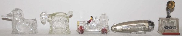 Lot of 5: Assorted Glass Candy Containers.: Includes one rare Zeppelin with incorrect closure, one radio, one duck, one spark plug with minor chip, and one fire engine. Condition (Excellent). Size Largest: 6" L.