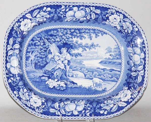 Large Blue Transferware Serving Platter.: Circa 1890. "Sheltered Peasants." Condition (Excellent). Size 17" L.