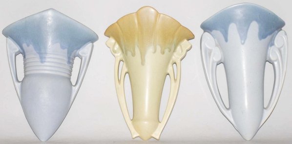 Lot of 3: Roseville Carnelian I Wall Pockets.: Larger blue pocket with small chip to bottom tip, small blue pocket with extra clay in hanging hole from factory, and green pocket with a tiny nick at rim. Condition (Good - Very Good). Size Largest: 