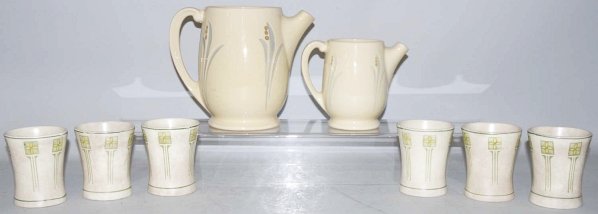Lot of 8: Roseville Creamware Pieces.: Includes six mugs that are all heavily crazed and stained (a couple with chips at base), one small pitcher, and one larger pitcher with chipping at spout. Condition (Good - Very Good). Size Largest: 7