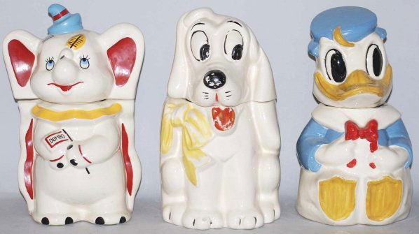 Lot of 3: Walt Disney Cookie Jars.: Includes a Donald Duck/Joe Carioca turnabout, a Dumbo turnabout and a Dumbo/Pluto turnabout. Donald turnabout has a large chip on rim and Dumbo/Pluto has moderate paint loss. Condition (Excellent). Si