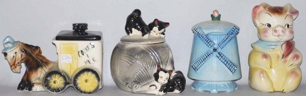 Lot of 4: American Bisque & McCoy Cookie Jars.: Includes boy pig, kittens on ball of yarn and a milk wagon. All by American Bisque. Also one windmill by McCoy. The Boy pig has one hairline. Condition (Very Good). Size Largest: 13" L.