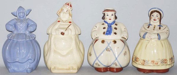 Lot of 4: Assorted Cookie Jars.: Includes a Shawnee Dutch Boy, a Shawnee Dutch Girl, a Pottery Guild Dutch Girl and Old King Cole. The Shawnee Dutch Girl has a mismatched top and bottom and Old King Cole has heavy crazing and a few h