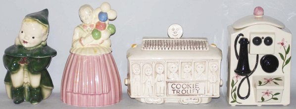 Lot of 4: Assorted Cookie Jars.: Includes a Brush Peter Pan, a Pottery Guild balloon lady, a Treasure Craft Cookie Trolley and an unidentified wall telephone jar. Peter Pan has a rim chip and moderate crazing. Balloon lady has modera