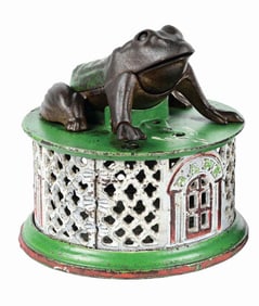 J. & E. STEVENS FROG ON ROUND BASE CAST IRON MECHANICAL BANK