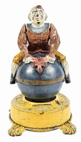 J. & E. STEVENS CLOWN ON GLOBE CAST IRON MECHANICAL BANK
