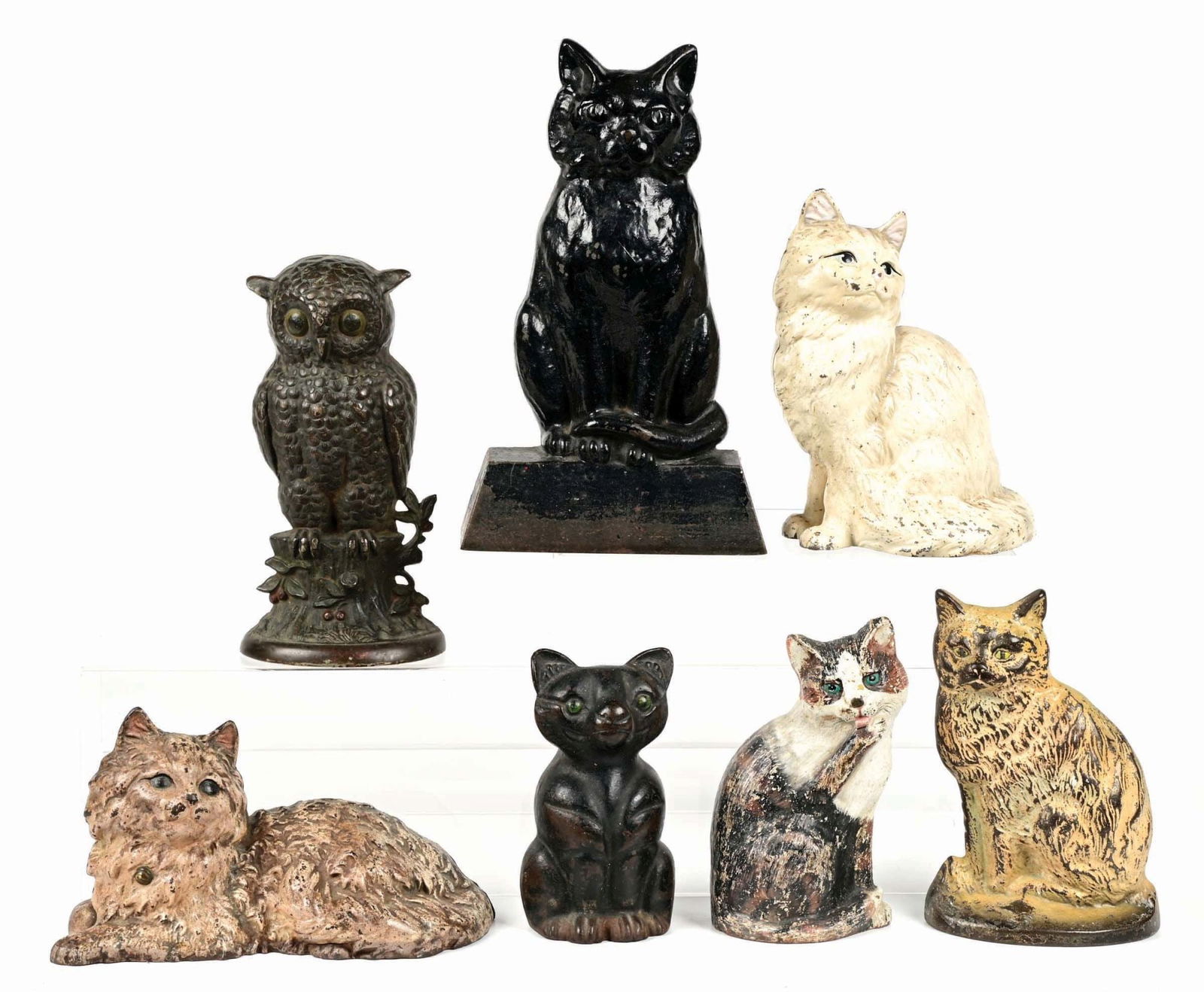 LOT OF 7: CATS & OWL FIGURATIVE CAST IRON DOORSTOPS: Nice grouping of animal doorstops. Most in excellent plus condition. This is not a standard shippable item and will require 3rd party shipping or pickup arrangements to be made. Condition: (Excellent)