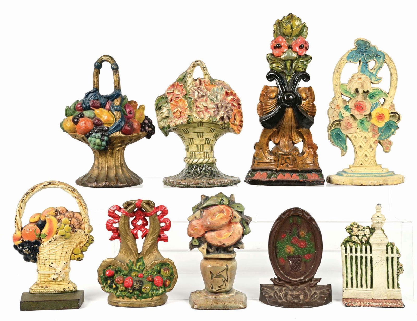 LOT OF 9: FLORAL & FRUIT BASKETS CAST IRON DOORSTOPS: Nice grouping of 9 floral doorstops. Most are excellent plus condition. Condition: (Excellent) Dimensions: Largest: 6 - 1/2" x 3" x 14".
