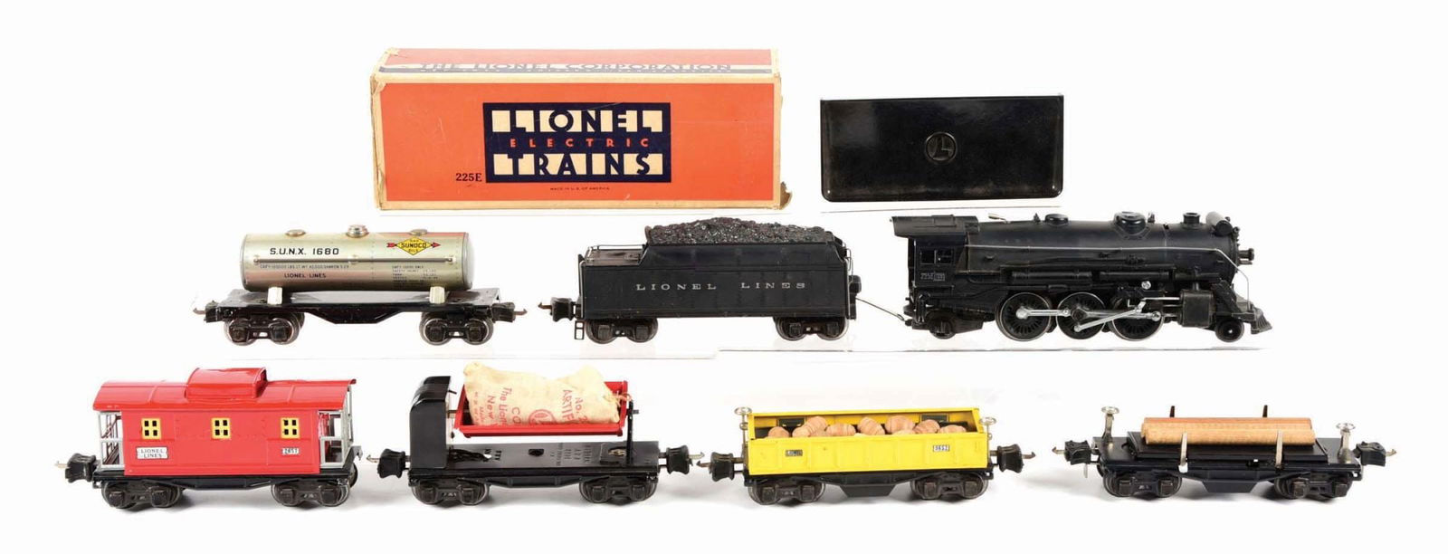LIONEL PRE-WAR NO. 225 FREIGHT SET: C. 1940s. Comes with engine, box and sleeve, missing end flaps. There is a Lionel Lines No. 2235-W Tender, marked "Lionel Lines" on both sides, a No. 1680 Sunoco Tank Car, a No. 3659 Dump Car with coa
