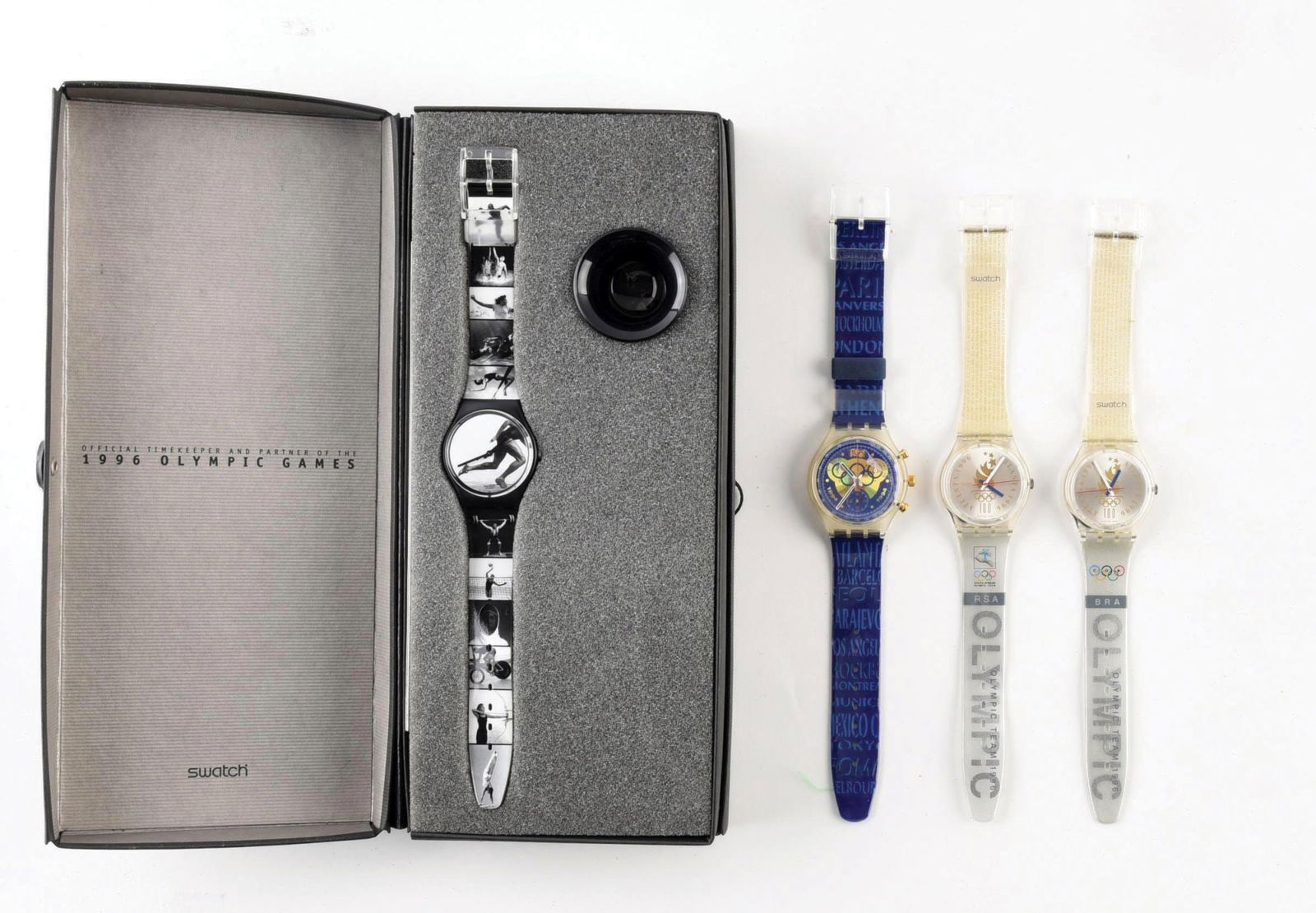 LOT OF 4: OLYMPIC SPECIALS SWATCHES: (A) GB178 "Olympic Portraits" Olympic Specials Swatch Watch. Designed by Annie Leibovitz. Issued in 1996. (B) SCZ101 "IOC 100" Olympic Specials Swatch Watch. Designed by Andrea Arrigoni. Issued in 199