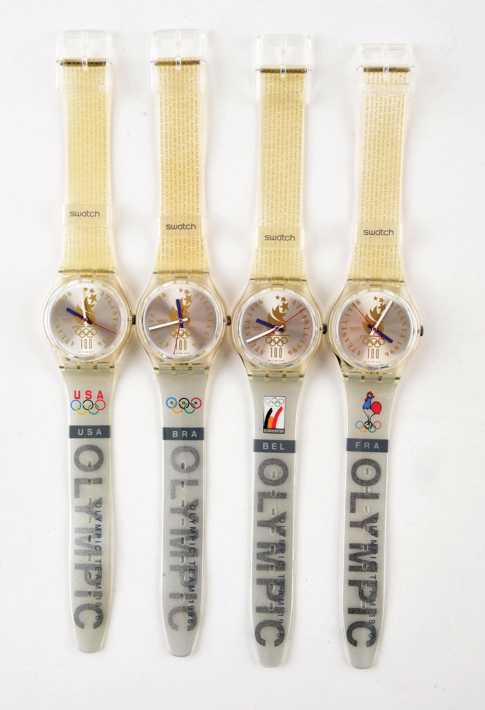 LOT OF 4: OLYMPIC SPECIALS SWATCHES: (A) GZ150J "Olympic Team USA" Olympic Specials Swatch Watch. (B) GZ150R "Olympic Team BRA" Olympic Specials Swatch Watch. (C) GZ150L "Olympic Team BEL" Olympic Specials Swatch Watch. (D) GZ150F "Olymp