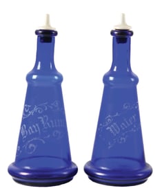 PAIR OF BLUE GLASS DECORATIVE BARBERSHOP BOTTLES.